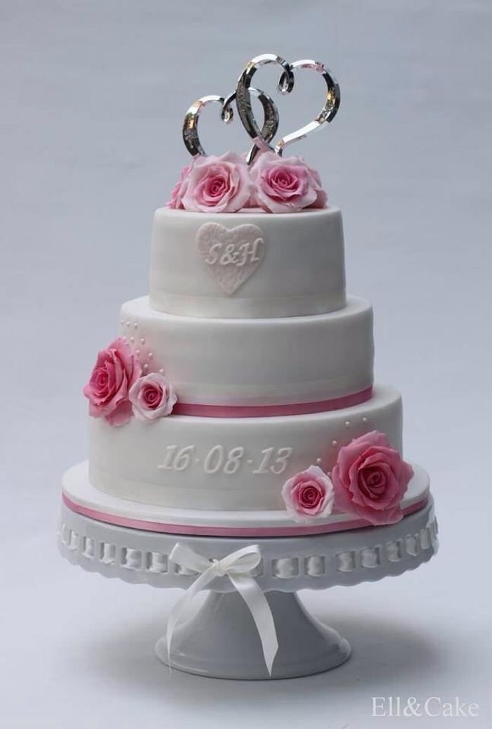 Wedding cake with pink sugar roses