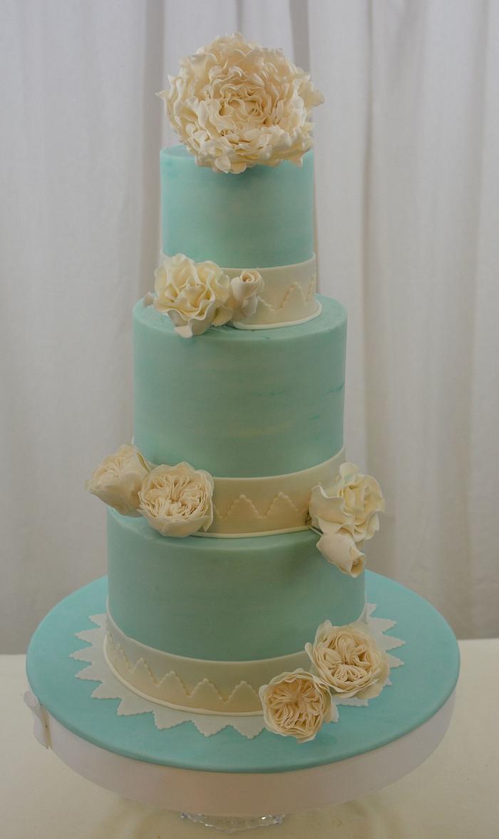 Teal Cake with White Sugar Flowers