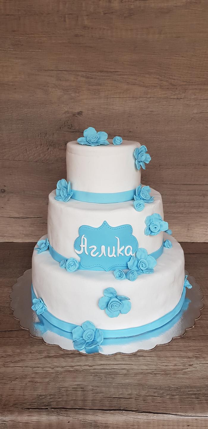 White cake with blue flowers