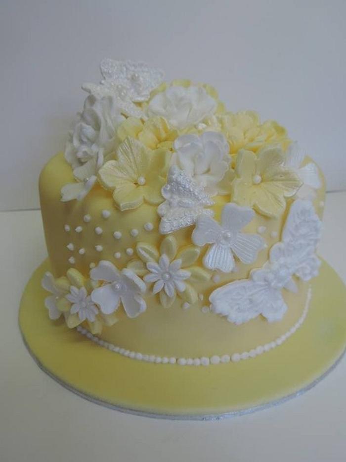 6 inch lemon roses and butterflies with matching cup cakes
