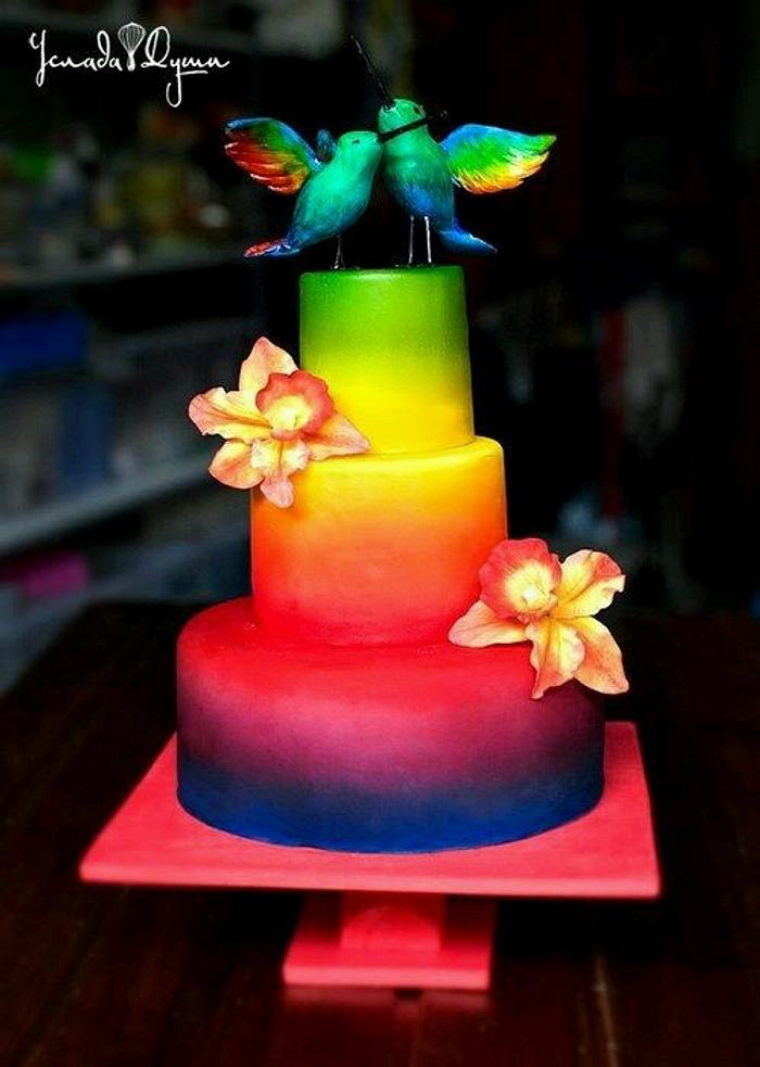 Wedding gradient cake with hummingbird topper