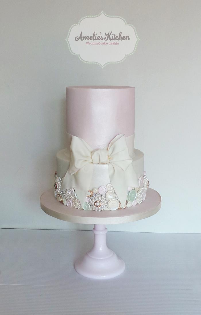 Vintages buttons and bow wedding cake