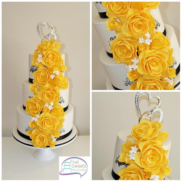Wedding cake with yellow sugar roses