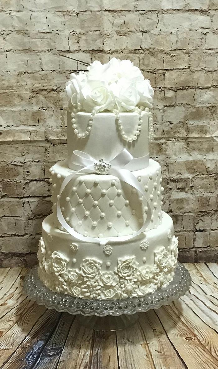 Bas relief and quilted design wedding cake