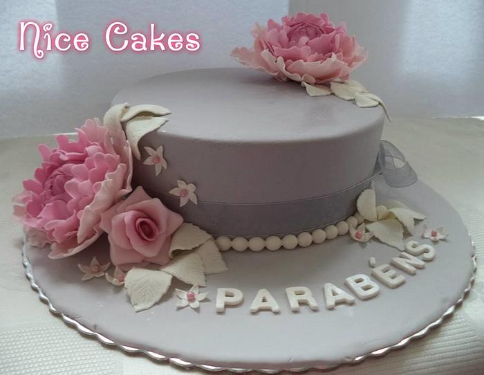 Grey cake with flowers.