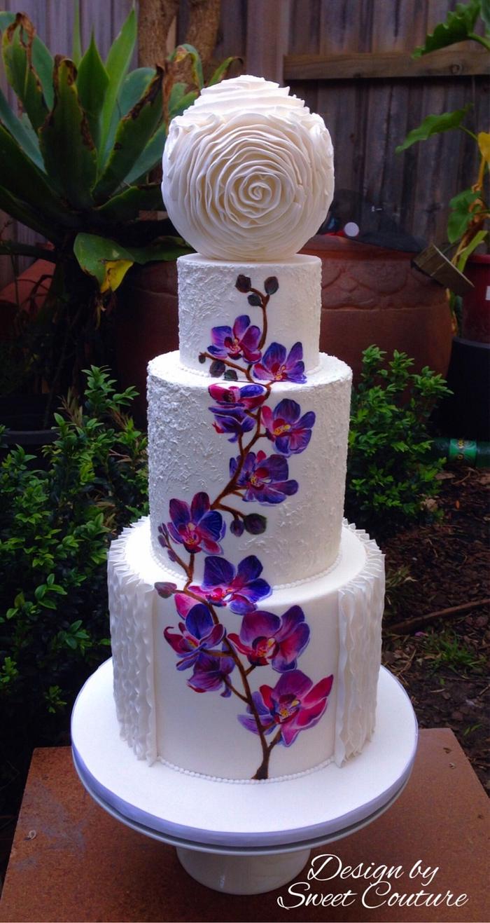 Hand painted orchids wedding cake.