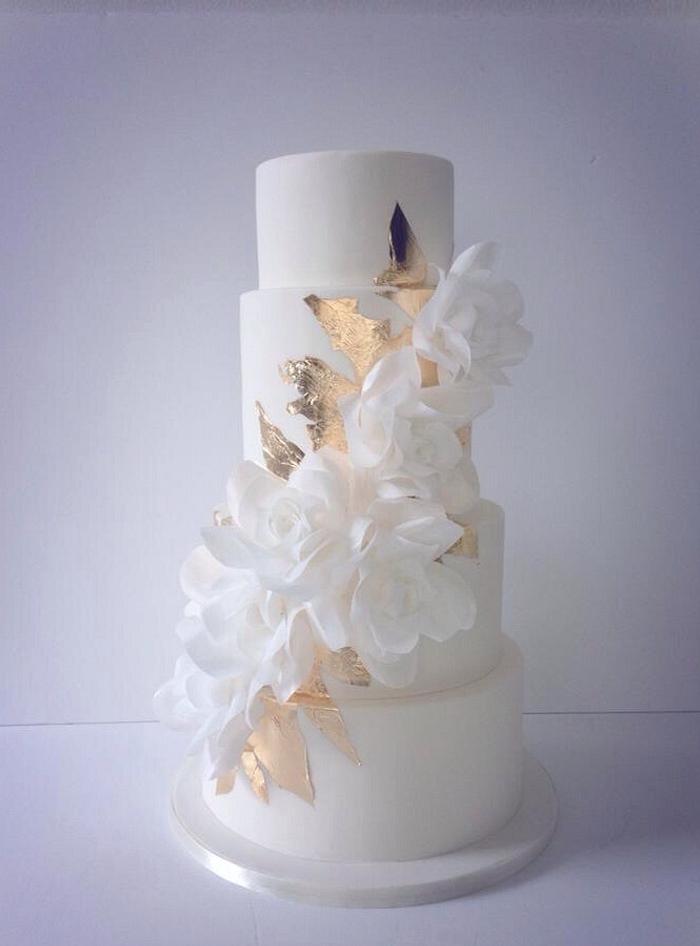 Cascading wafer paper roses and gold leaf wedding cake 