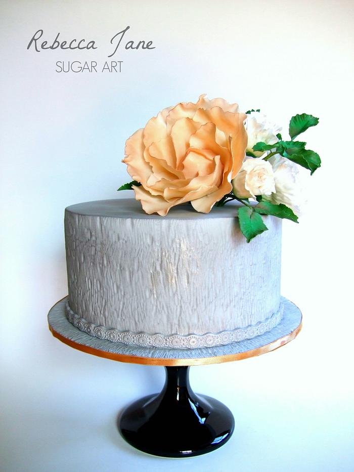 Grey textured cake with sugar flowers