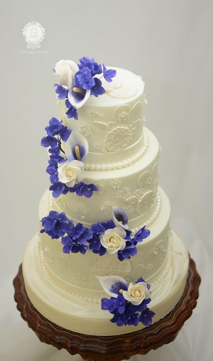 White Wedding Cake with Purple Sugar Flowers