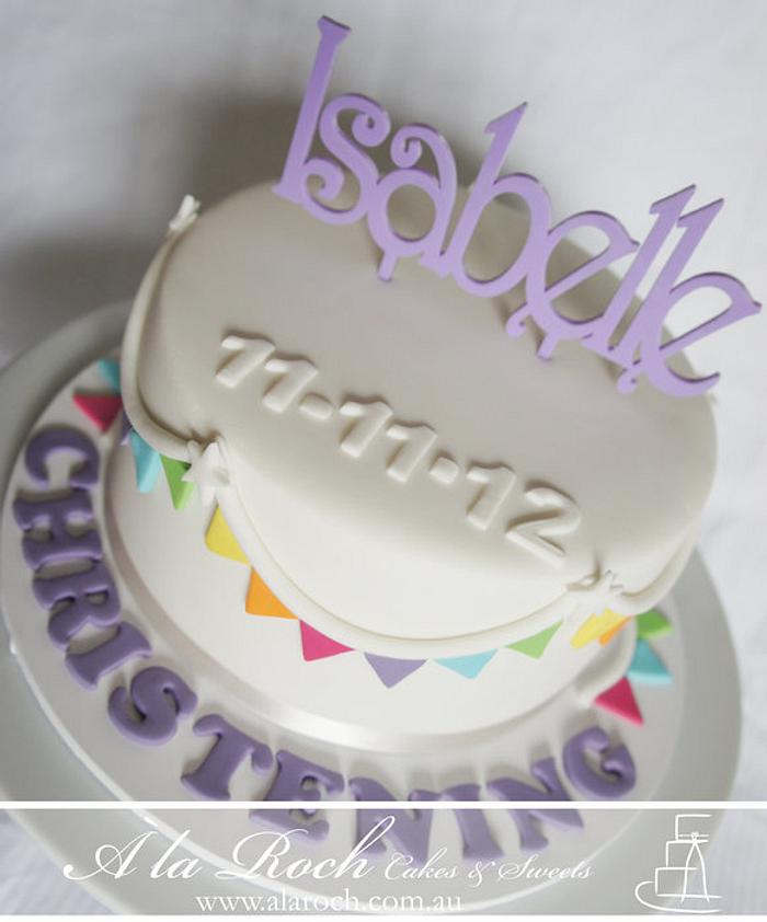 Rainbow bunting christening cake
