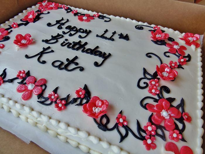 Buttercream cake with coral fondant flowers