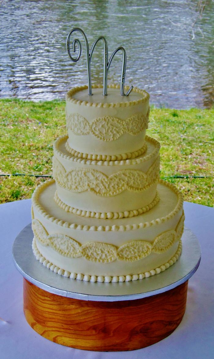 Buttercream wedding cake by river