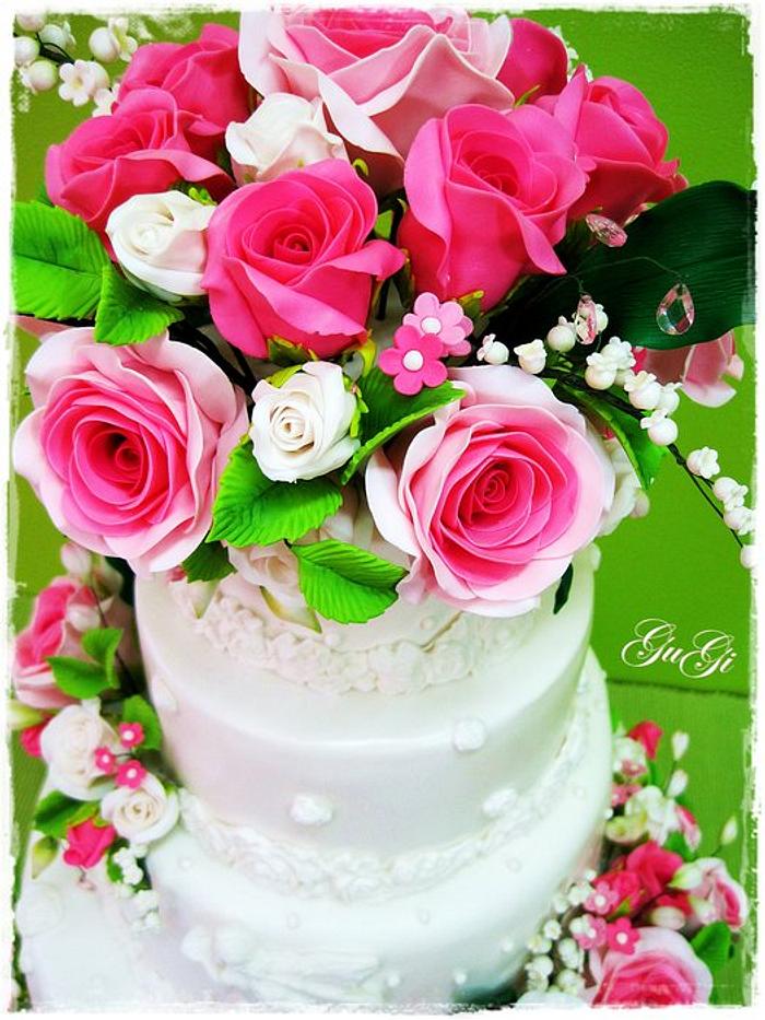 Cake with roses and lilies of the valley