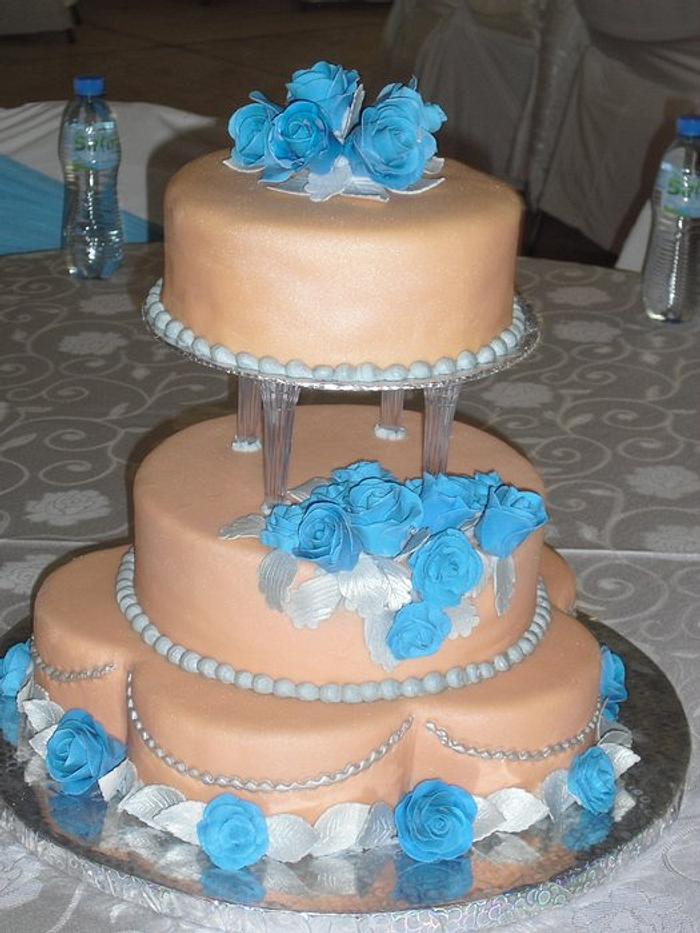Peach and turquoise wedding cake