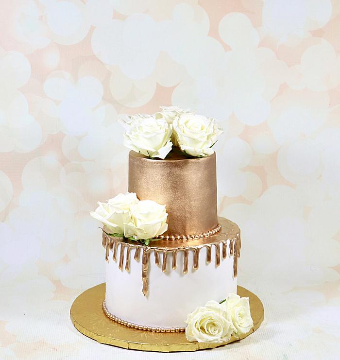 White and gold drip cake 