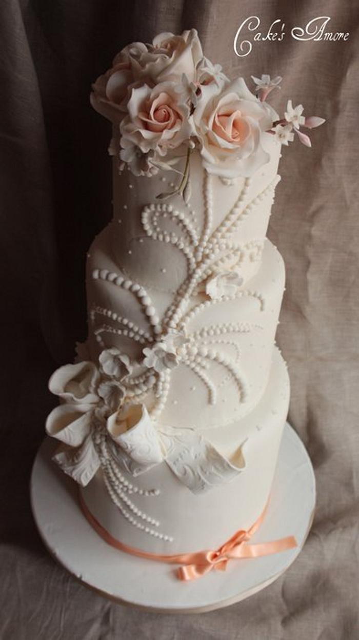 wedding cake with pearls and roses