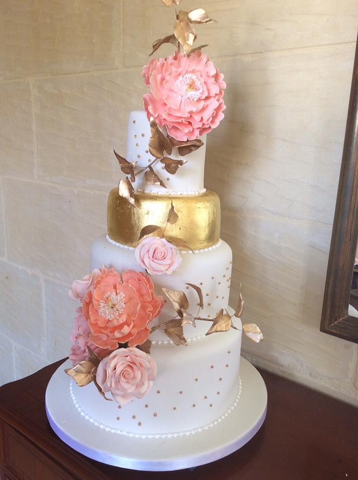Gold leaf and peonies wedding cake