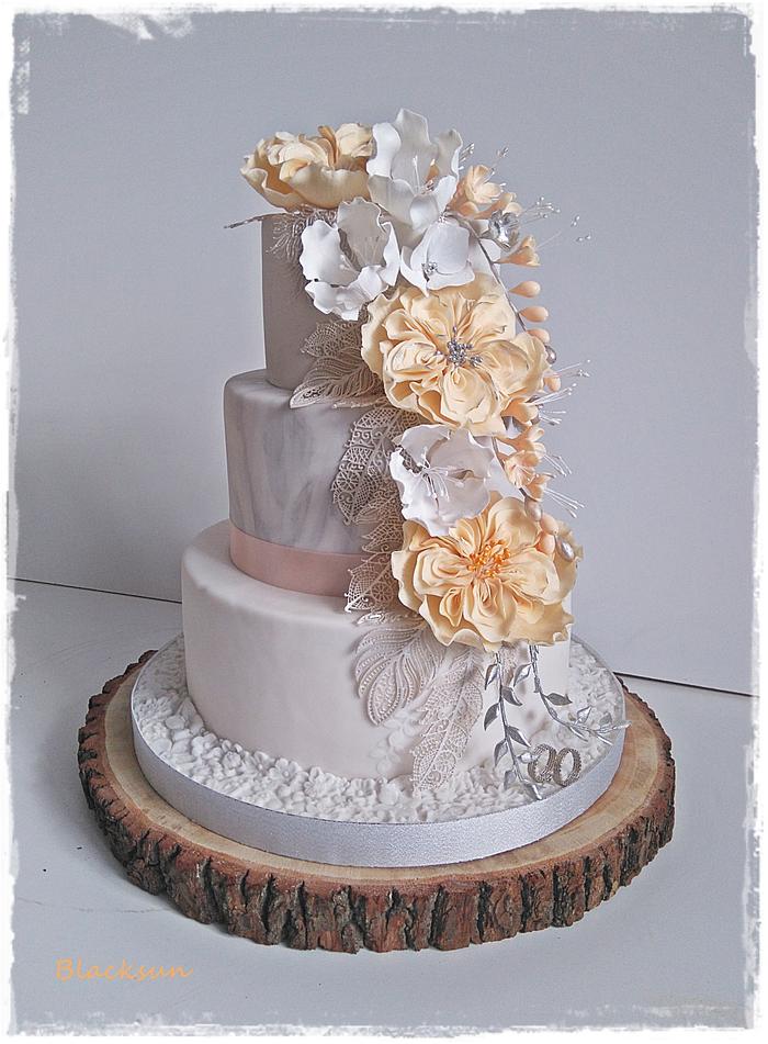 Wedding cake with silver feathers