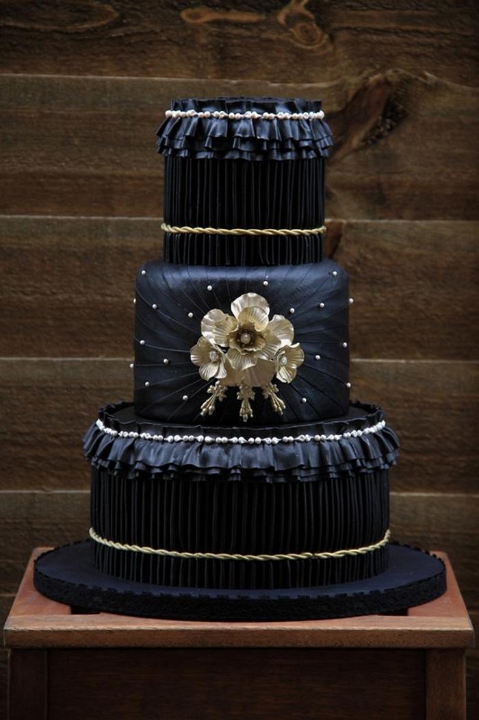 black and gold pleated wedding cake