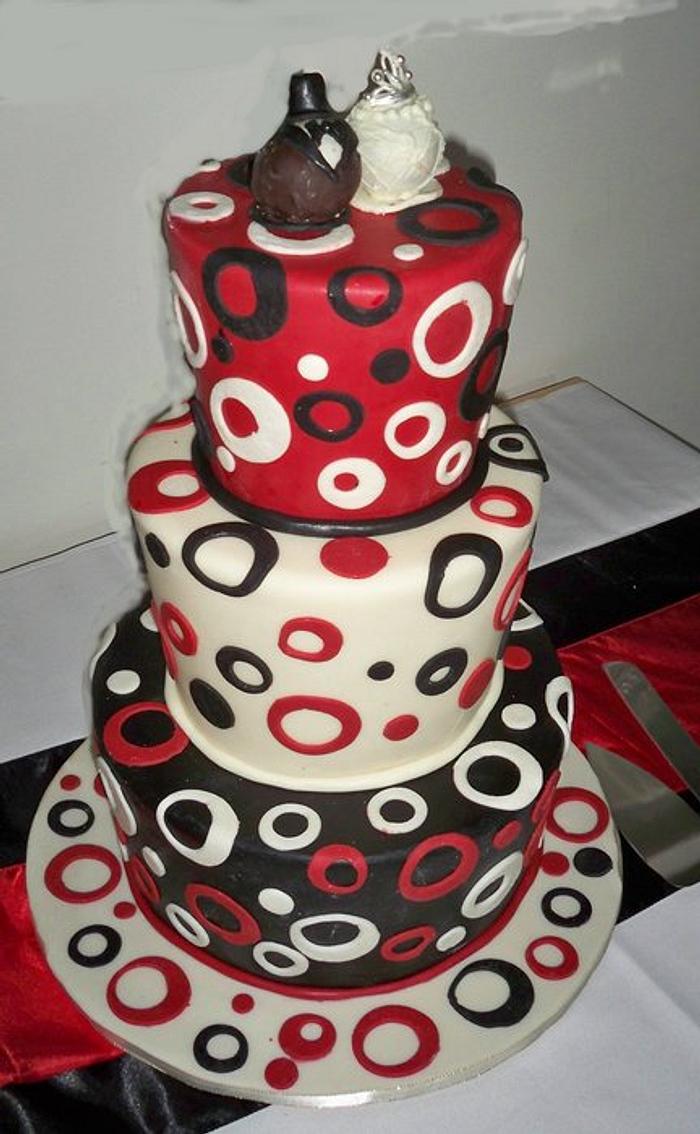 red and black topsy turvey wedding cake