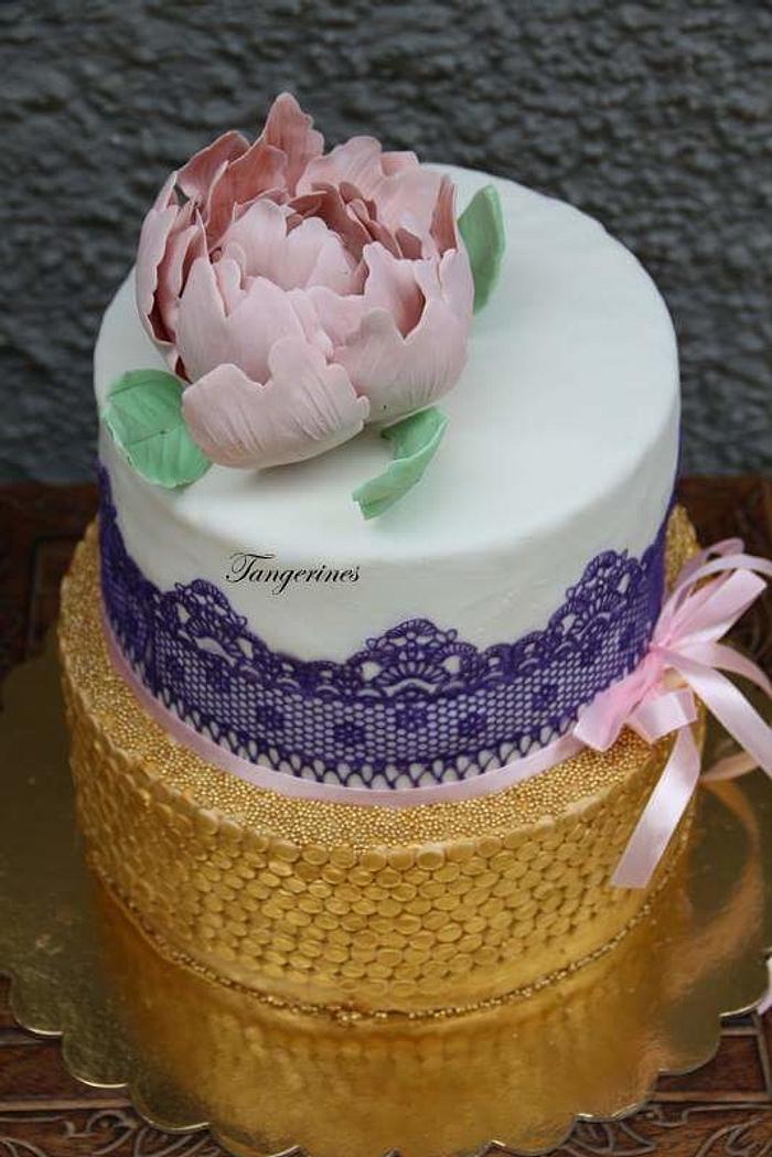 Gold purple and pink themed wedding cake