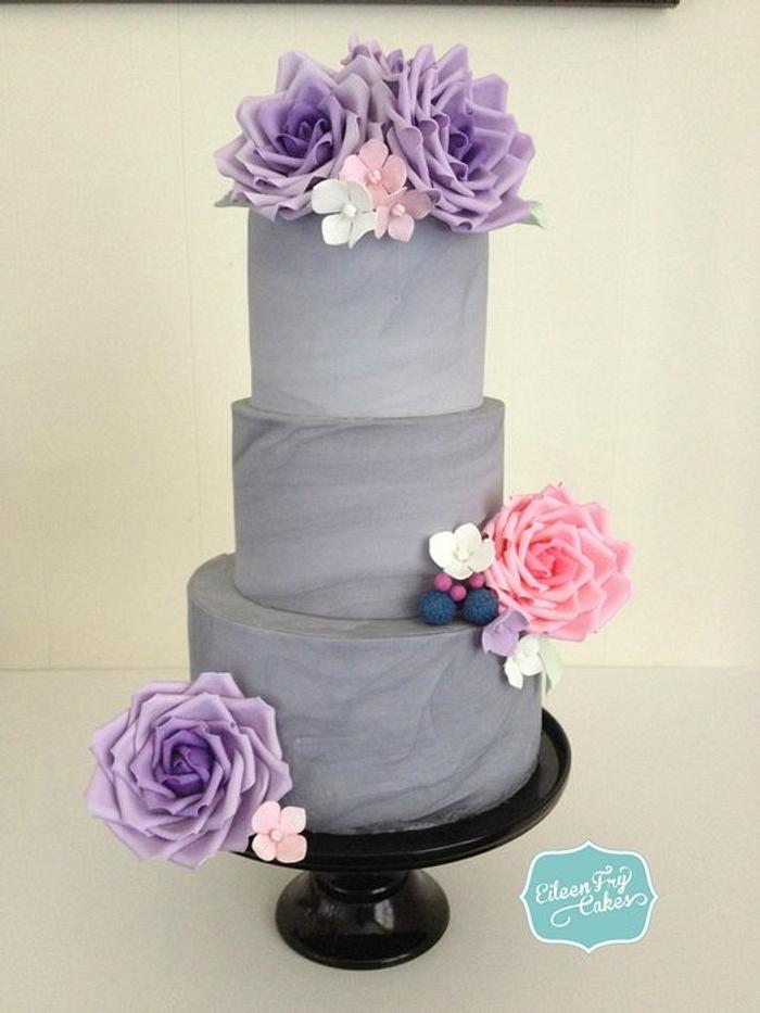 Grey marbled wedding cake with sugar roses