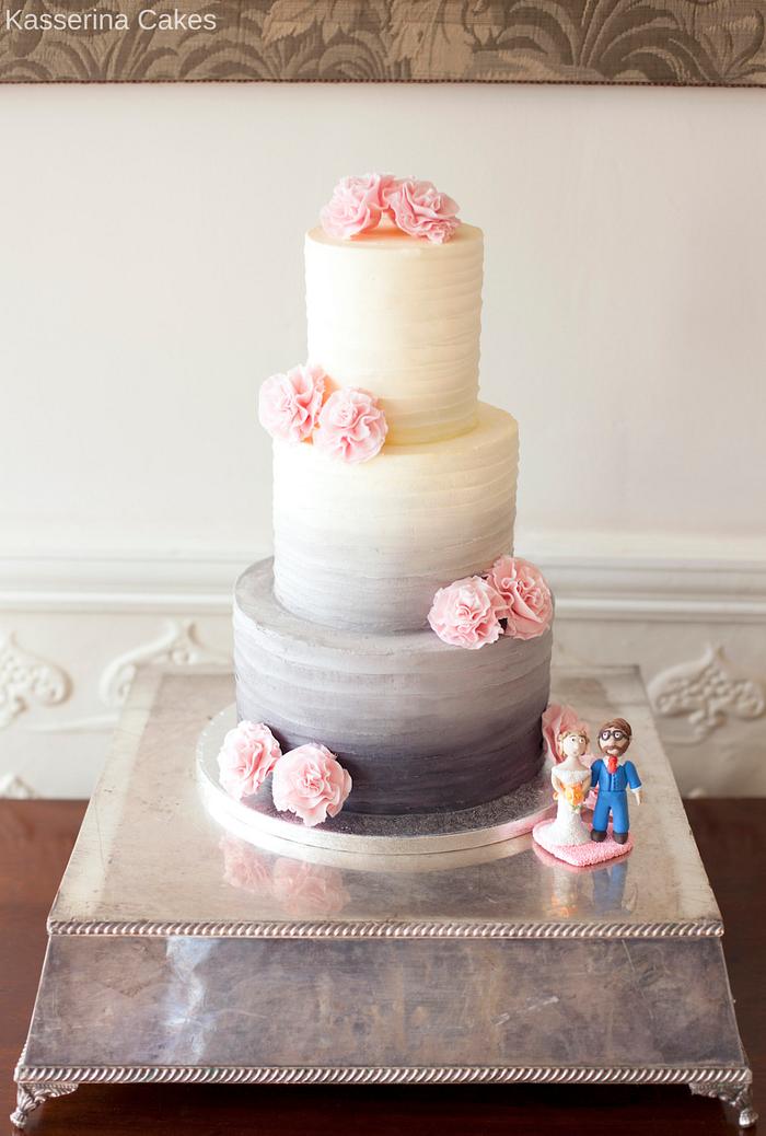 Grey ombre buttercream wedding cake with pink ruffled ribbon roses