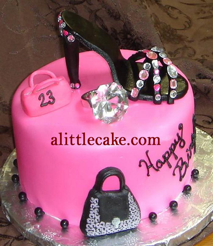 Pink fondant custom  birthday cake with black sugar shoe, purses and faux diamond ring