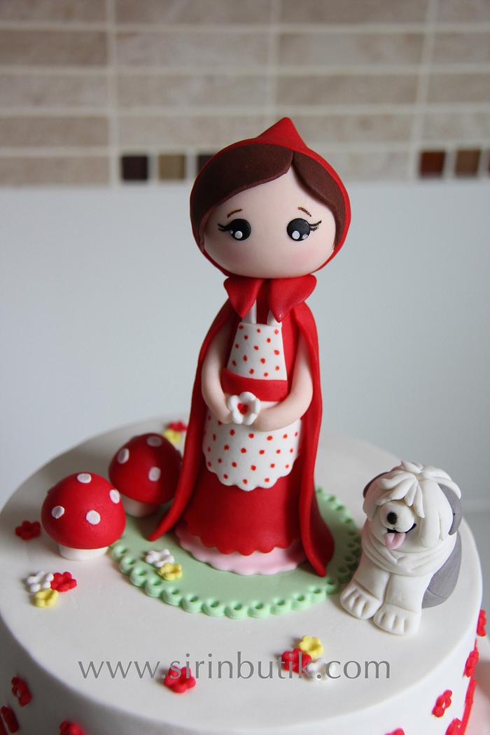 Little Red Riding Hook girl and her dog