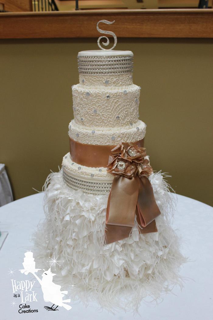 Lace and feather wedding cake