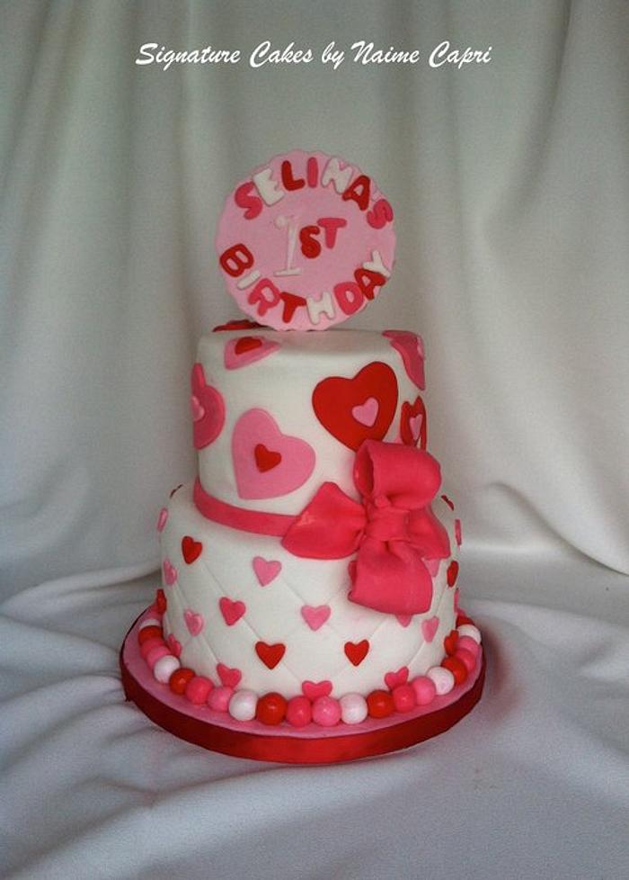 Valentine themed first birthday cake