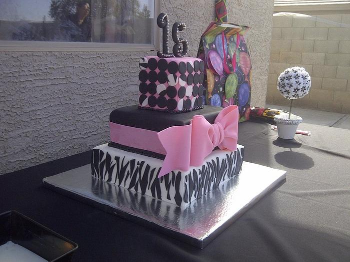 Pink and zebra print quinceanera cake