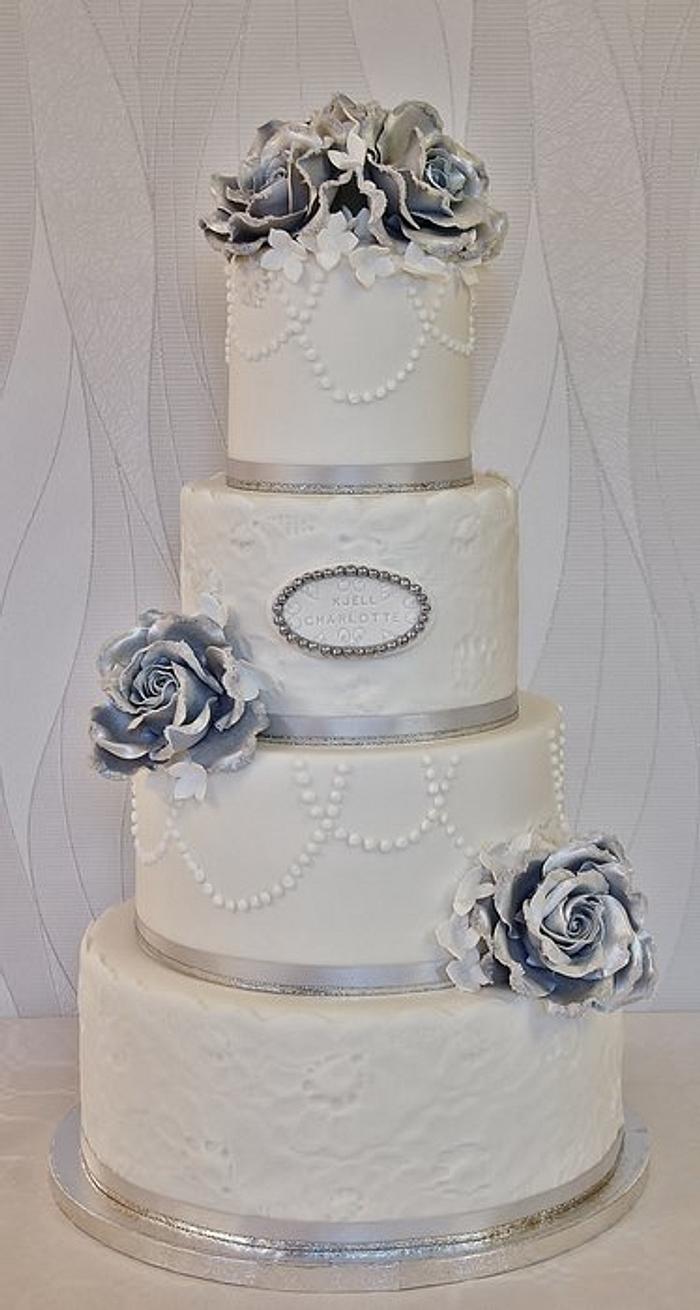 Silver/white wedding cake.