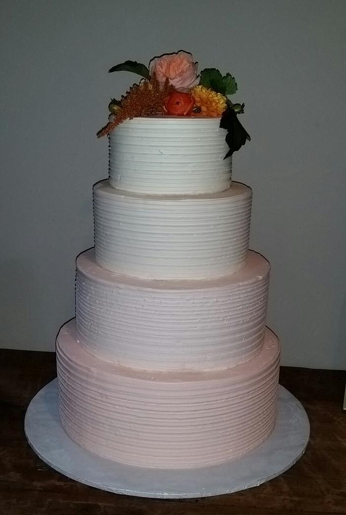 Peach ombre textured wedding cake