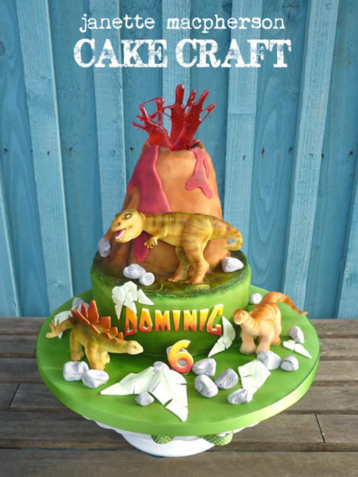Volcano and dinosaurs birthday cake