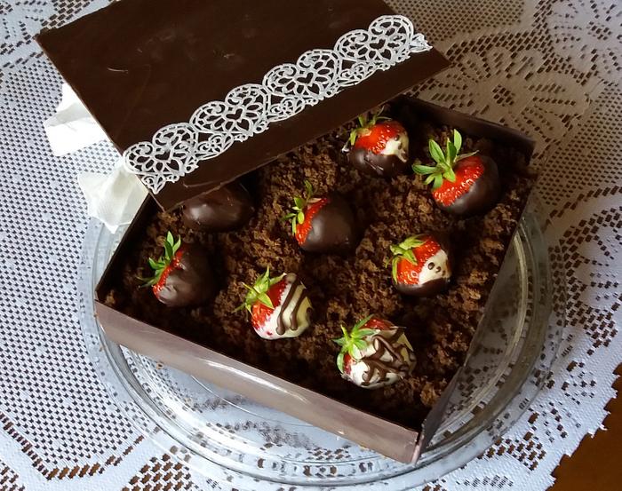 Chocolate cake box with strawberries