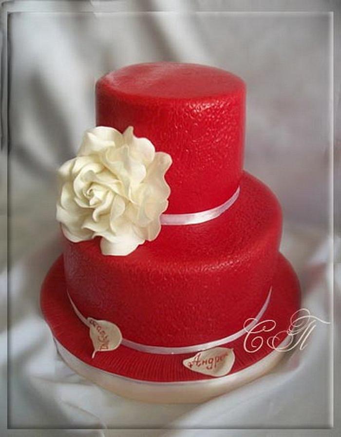 Red wedding cake with white rose