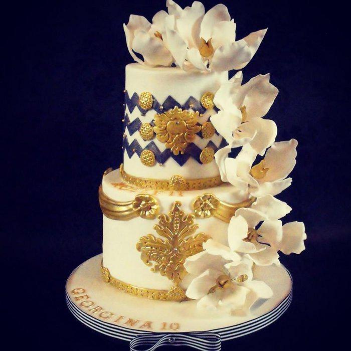 Blue, white and gold birthday cake