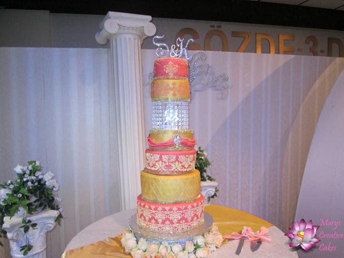 Salmon and gold indianstyle wedding cake