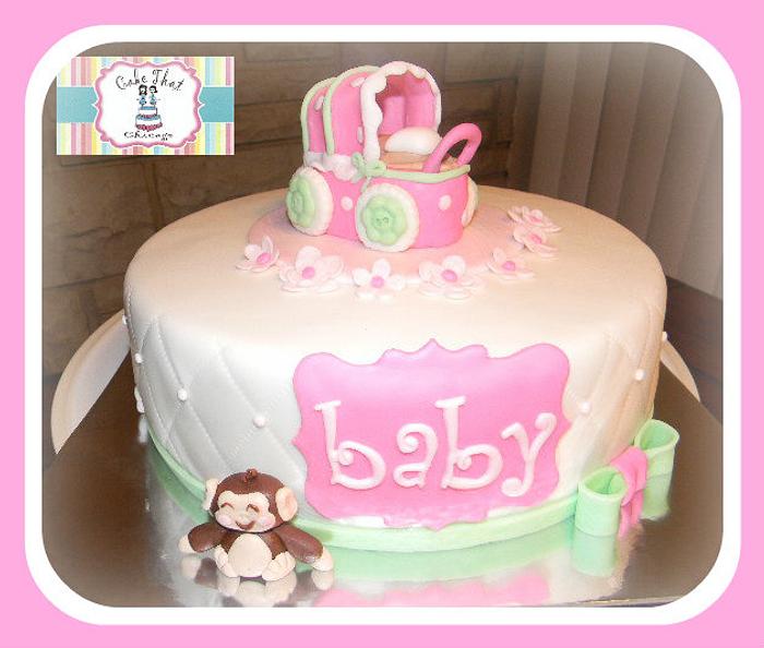 Carriage and monkey Baby shower cake