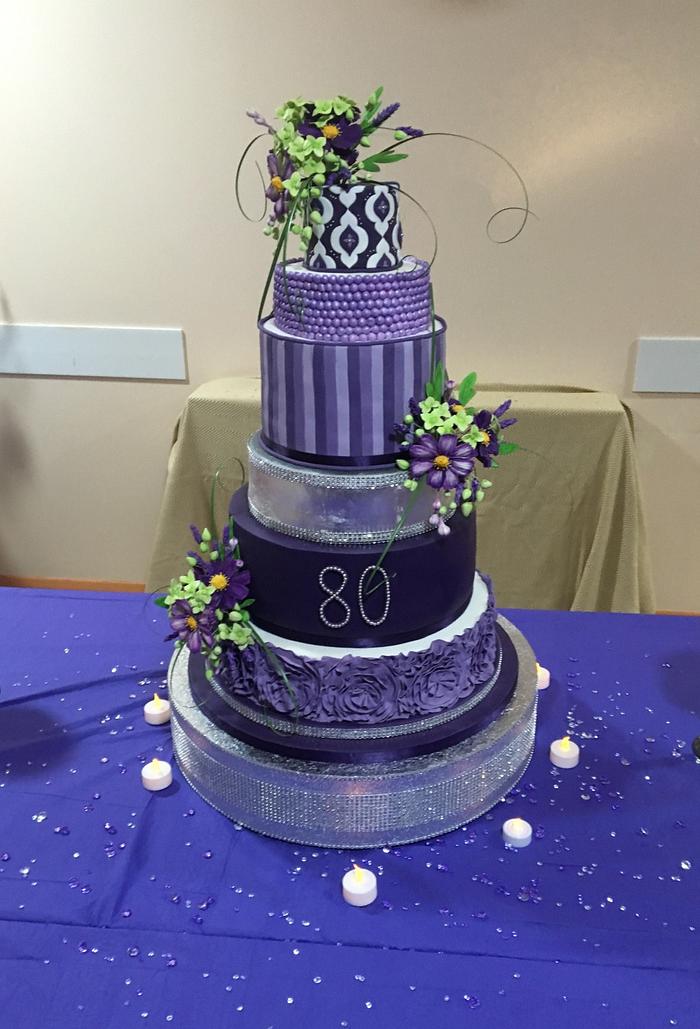 Purple six tier 80th birthday cake