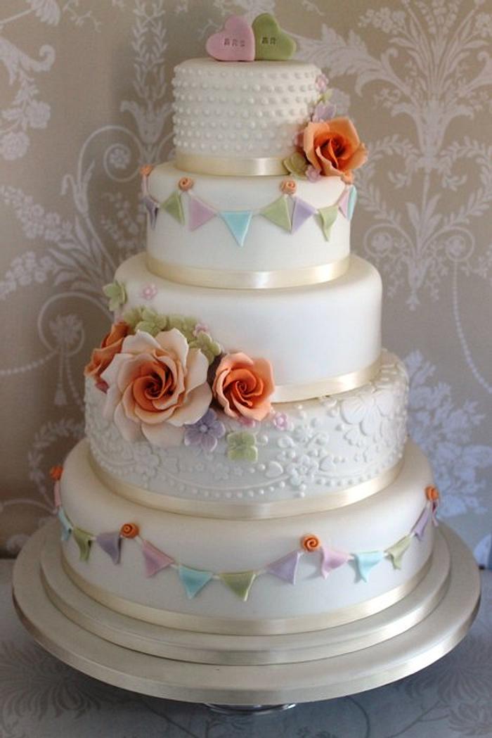 pastel flower and bunting cake