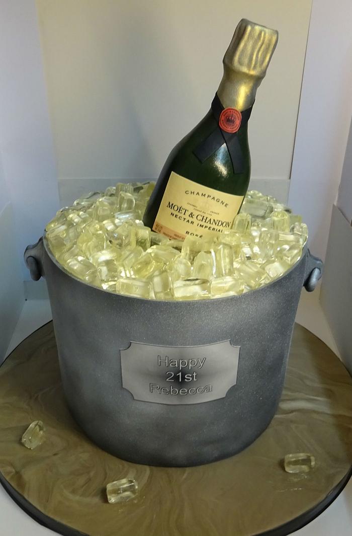 Champagne bottle in ice bucket.