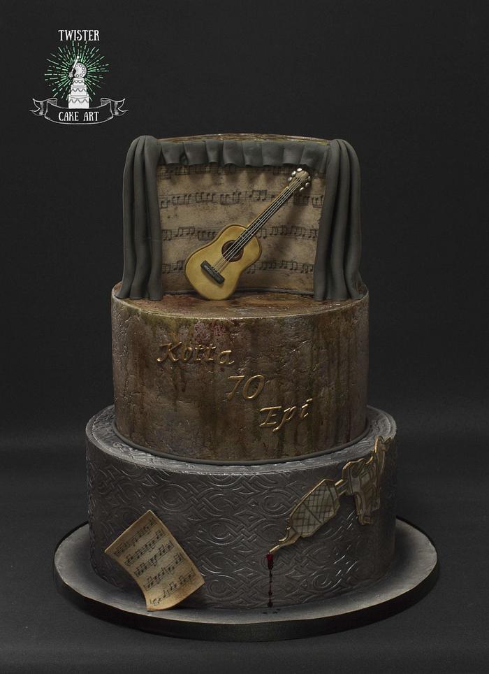 Guitar and tattoo themed cake