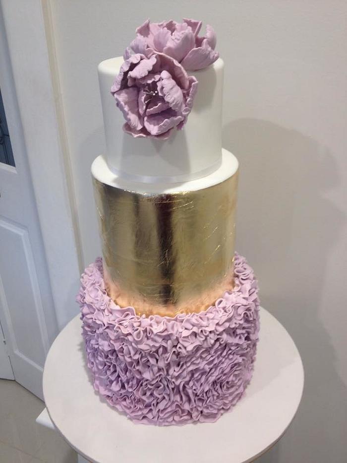 Gold and ruffle wedding cake 