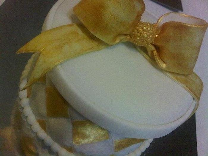 Gold trimmed gift box cake