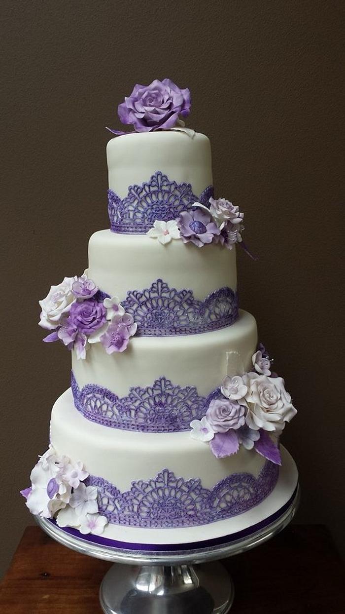 wedding cake with flowers and lace