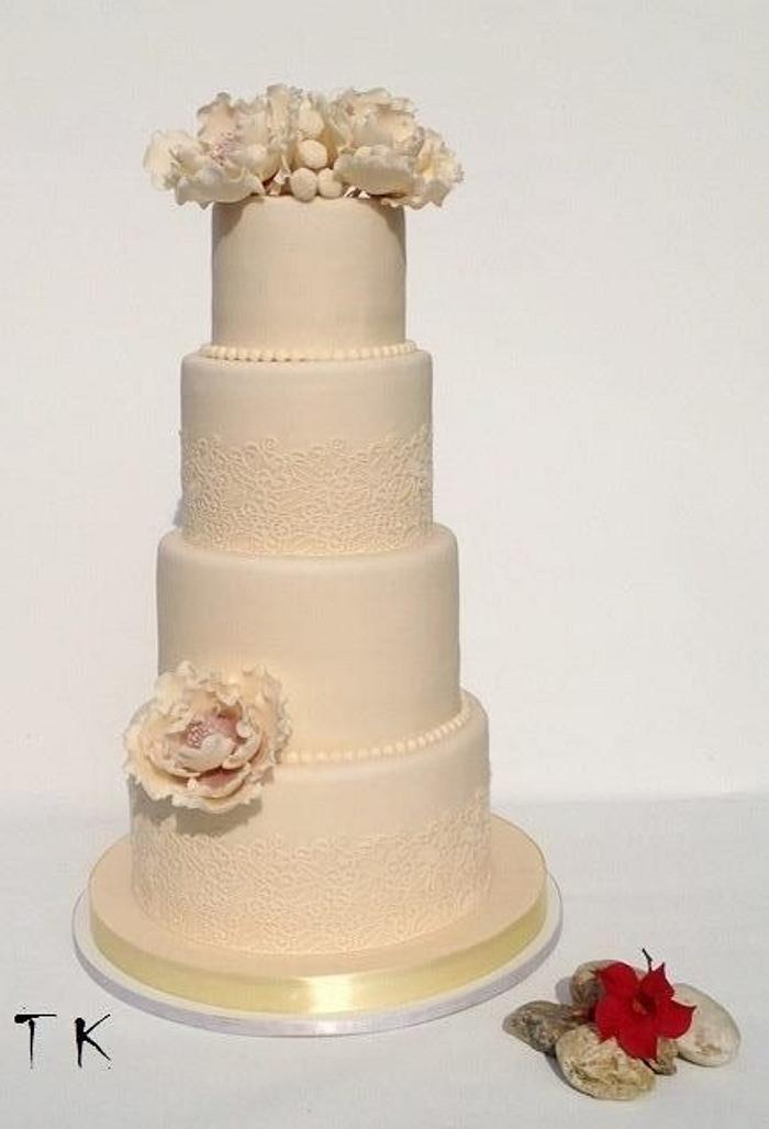 ivory wedding cake with edible lace