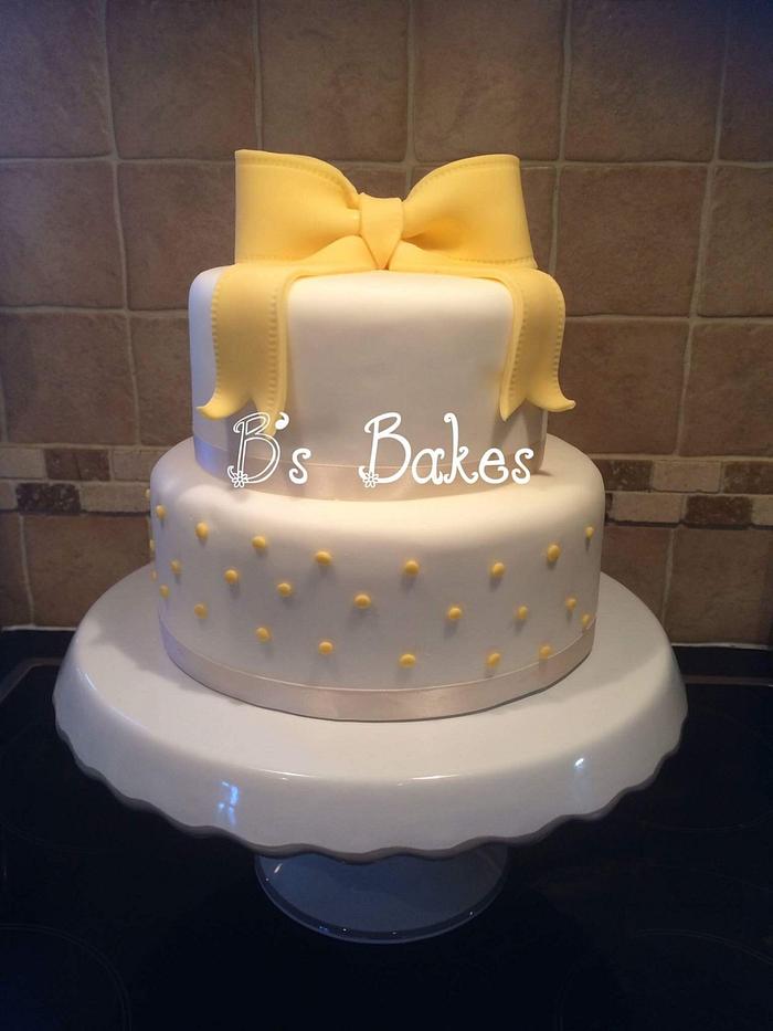 Two teir yellow bow cake