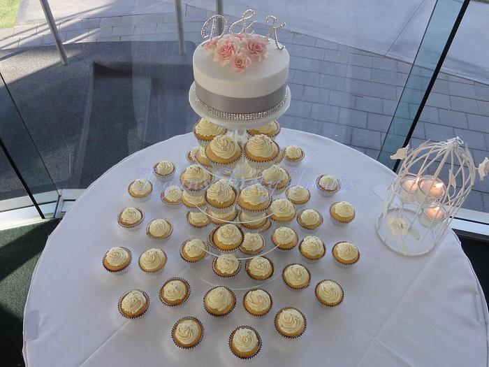 Elegant wedding cake/cupcake tower.